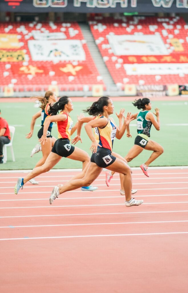 women running on track field